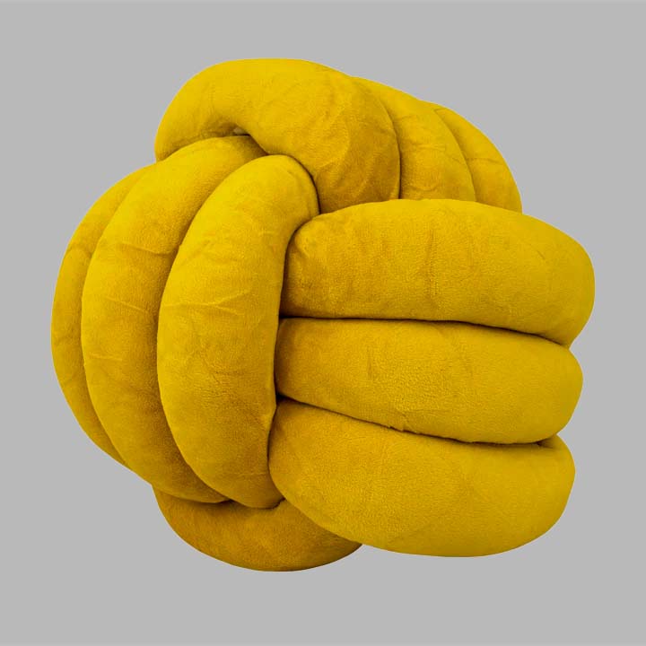 Cojín de ornato con forma de nudo en color amarillo